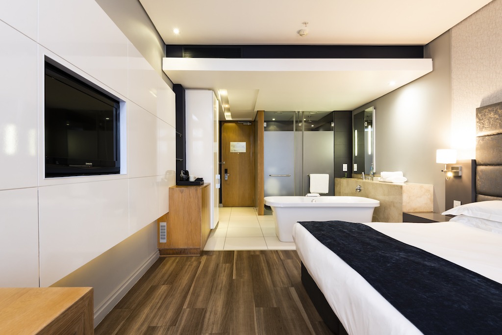 AHA Gateway Hotel — guest room with bathtub