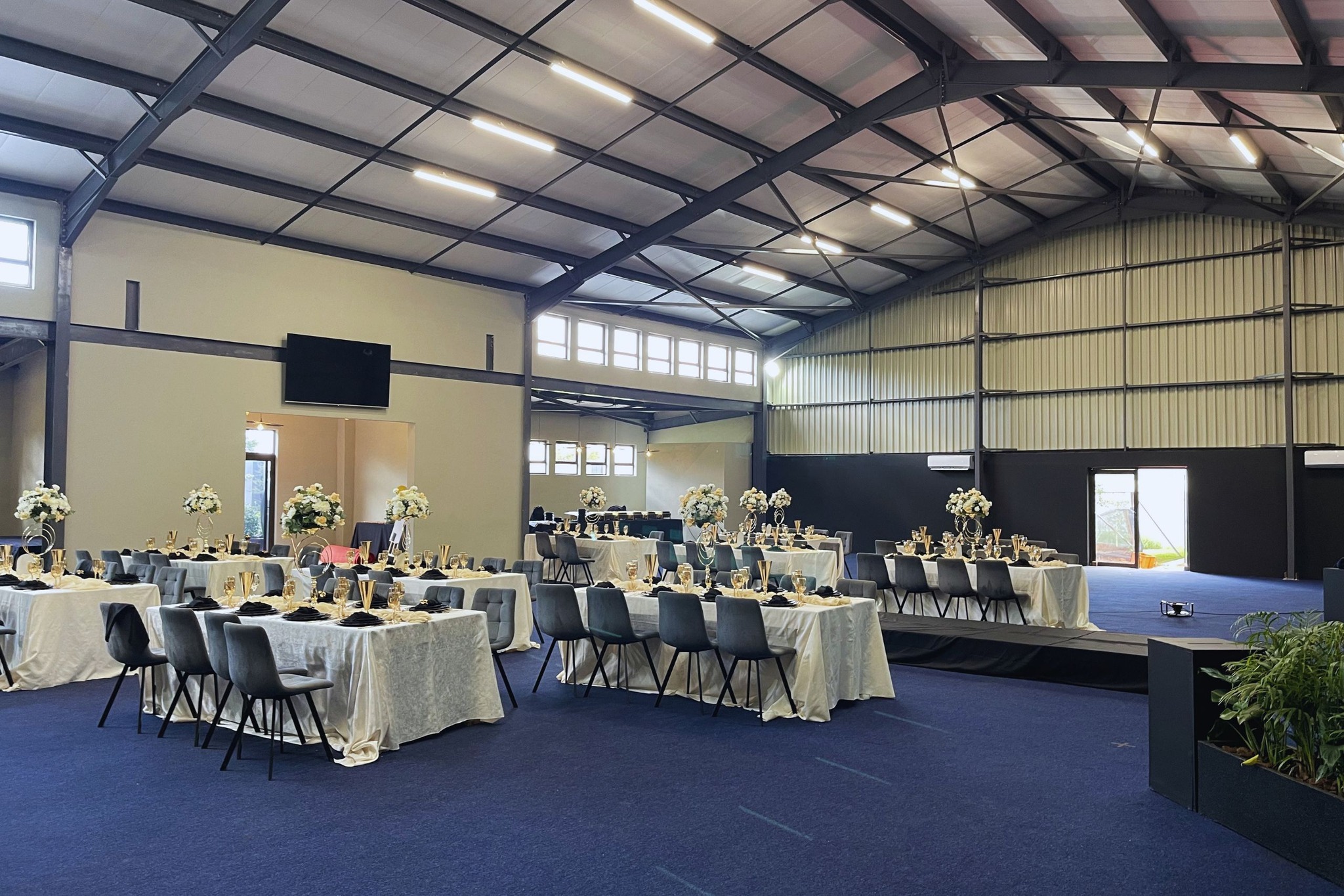 The Grand Hall set with round banquet tables for a corporate function at Apple Blossom Hotel, Venue & Spa, Honeydew