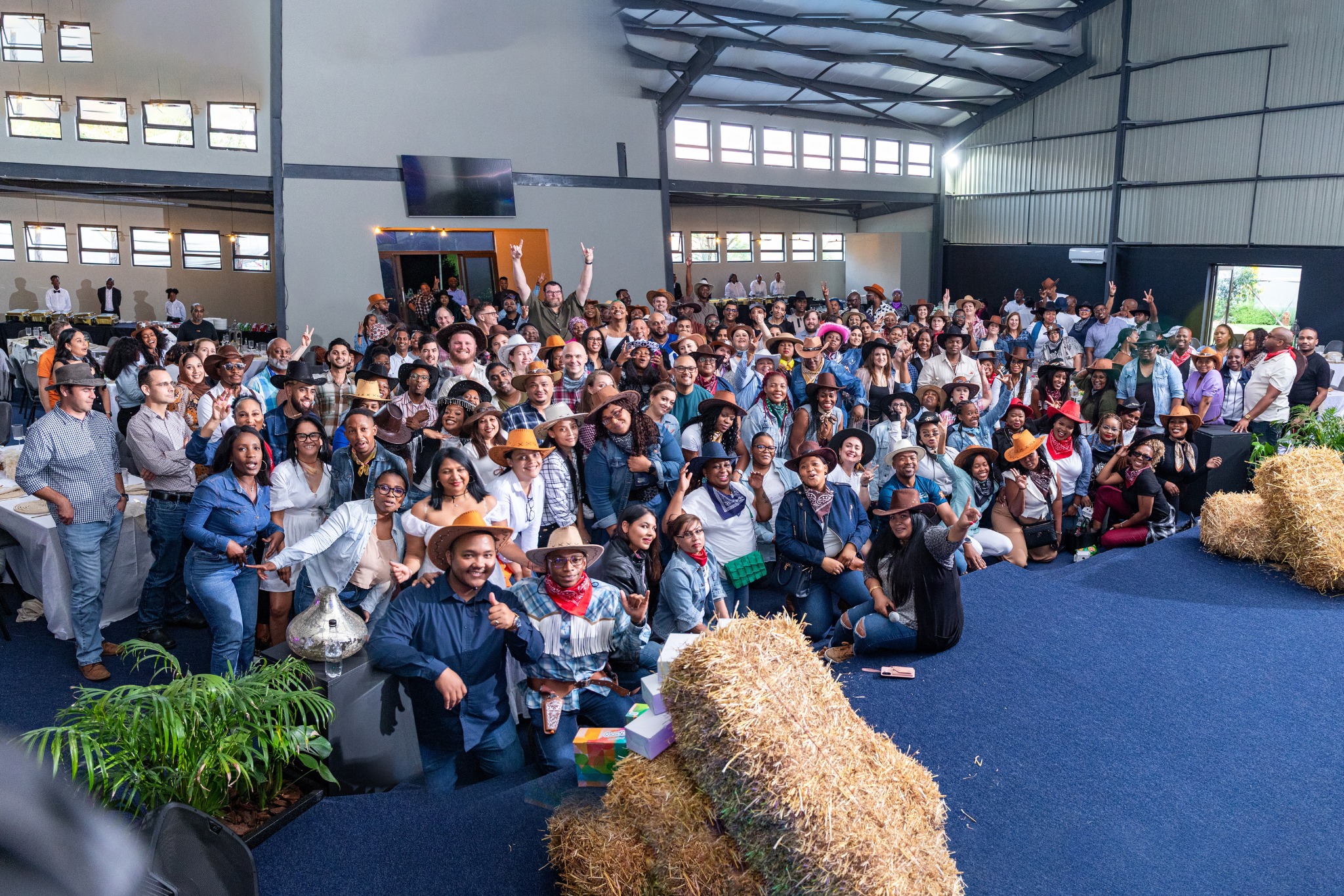 Large delegate audience at a themed corporate event in The Grand Hall, Apple Blossom Hotel, Venue & Spa, Johannesburg
