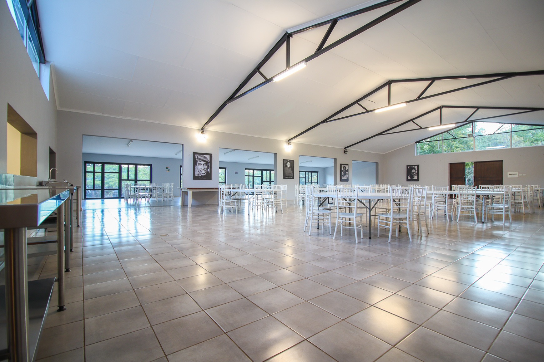 Large function and dining hall set with round banquet tables at Thuto Centre